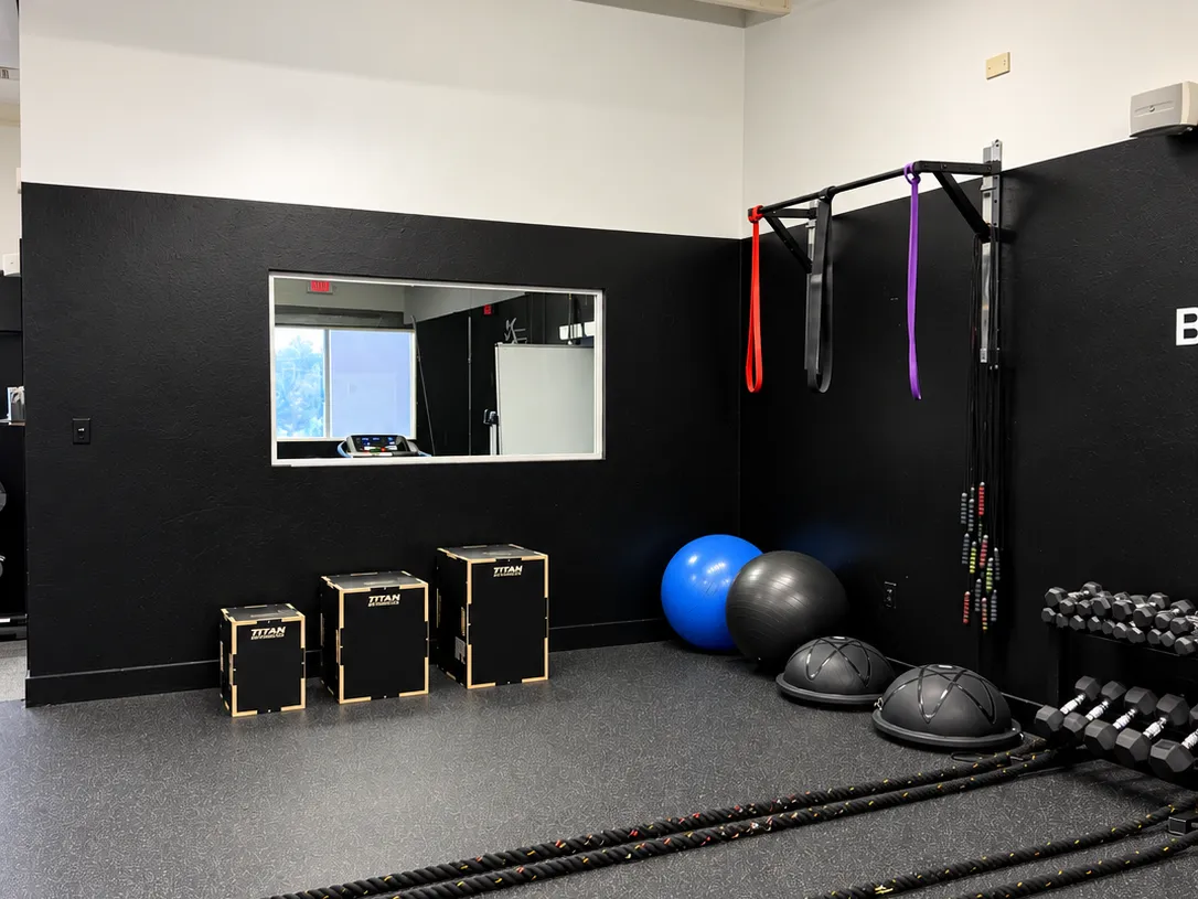 Functional training area with plyo boxes, balls and battle ropes at BodyRhythm